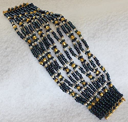 1168. Navy and gold netted string bracelet with a slide tube clasp.