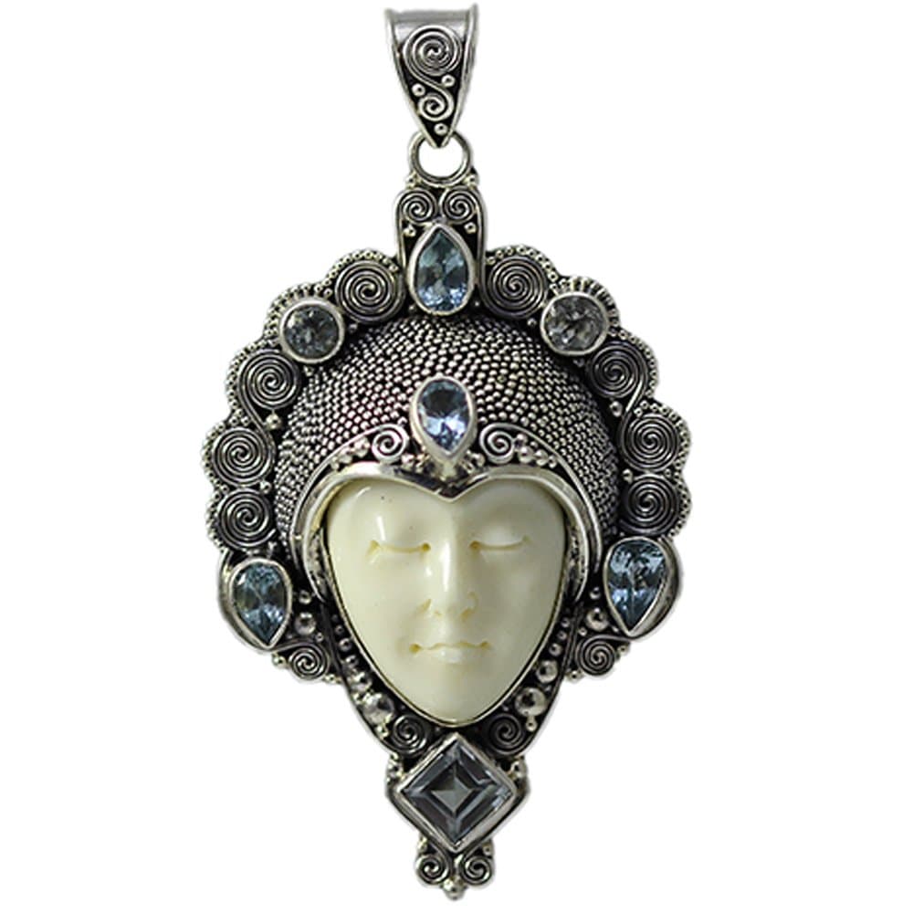 Large Carved Bone Face with Blue Topaz Pendant